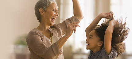 image of dancing grandmother and granddaughter